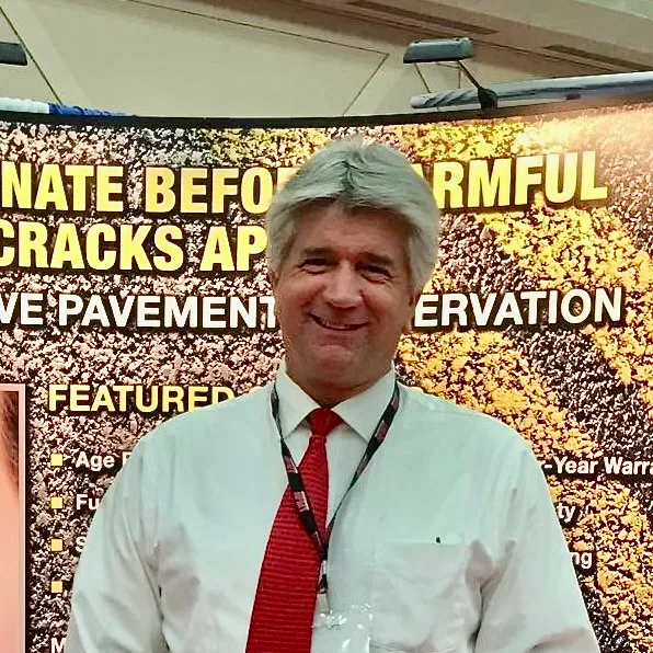 Jeff Pokorny, founder of TriTechnologies, at the company's pavement-preservation trade-show booth